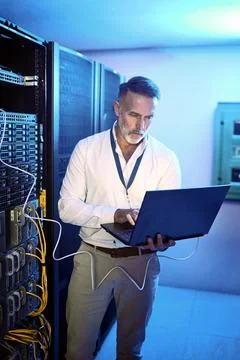 Cables, programmer and man in server room, laptop and cyber security with Stock-Fotos