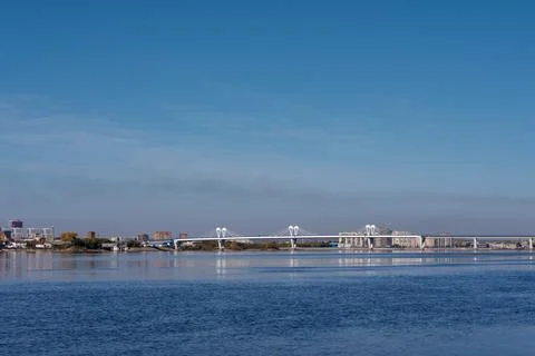 Cable?stayed bridge over Zeya river, capturing calm water, clear light and .. 스톡 사진