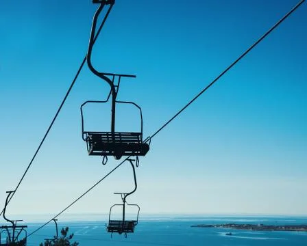 Cableway on background of blue sky Stock Photos