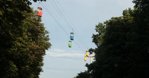 Cableway with cabins among trees moving Stock Footage 108723695