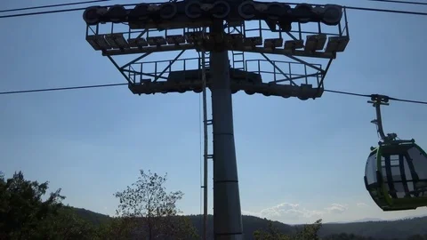 Cableway cabins (cable car cabin) above the mountain canyon Stock Footage 95599372