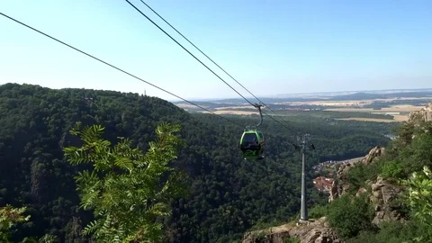 Cableway cabins (cable car cabin) above the mountain canyon Stock Footage 95599397