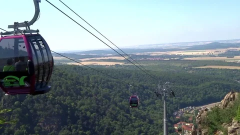 Cableway cabins (cable car cabin) above the mountain canyon Stock Footage 95599436