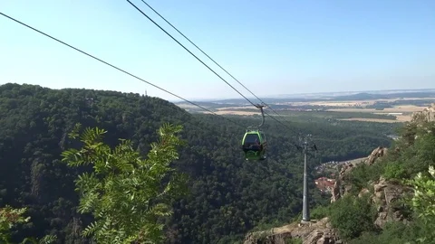 Cableway cabins (cable car cabin) above the mountain canyon Stock Footage 104815273