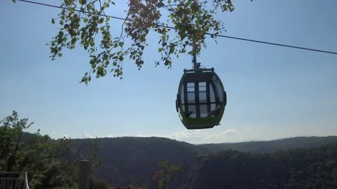 Cableway cabins (cable car cabin) above the mountain canyon Stock Footage 104815373