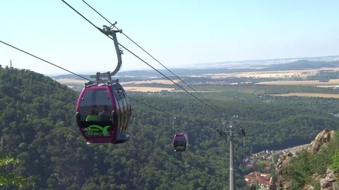 Cableway cabins (cable car cabin) above the mountain canyon Stock Footage 104815469