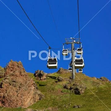 Cableway cabins over the slope of Elbrus in the North Caucasus. Stock Photos
