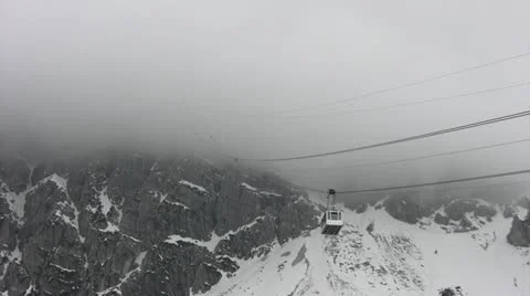 Cableway disappearing into the fog Stock Footage 11809613