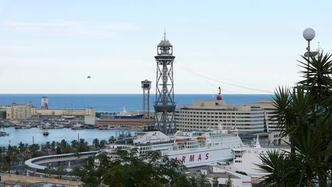 Cableway red cabins quickly move over Barcelona cruise port, liners and old Stock Footage 102922044