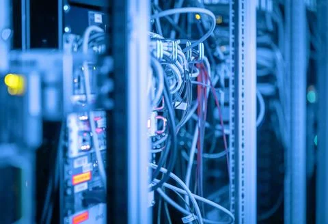 Cabling of a server room with Ethernet connections in blue technical light Stock Photos