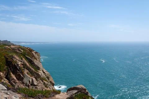 Cabo da Roca cliff overlooking vast atlantic ocean in Portugal. Tourist tour Stock Photos