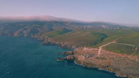 Cabo da Roca Cliffs rocks on Atlantic ocean Sintra summer Portugal 4K aerial Stock Footage 84657875
