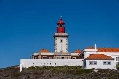Cabo da Roca Lighthouse with Red Top and White Walls Against a Clear Blue Sky Stock Photos