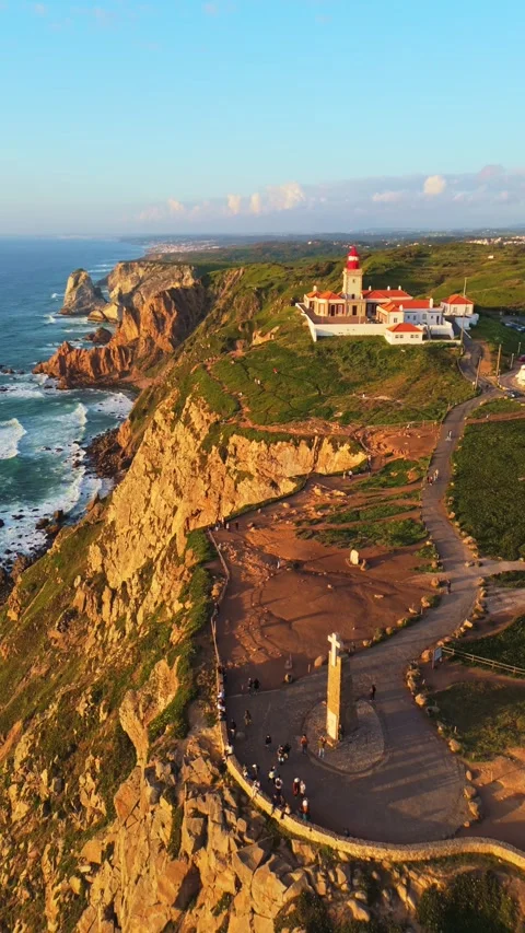 Cabo da Roca at Sunset. Cliffs, Lighthouse and Cross. Portugal. Aerial View Stock Footage 333898529