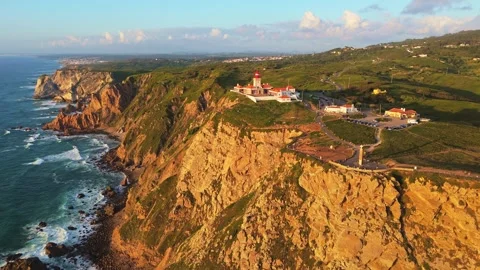Cabo da Roca at Sunset. Cliffs, Lighthouse and Cross. Portugal. Aerial View Stock Footage 333898560