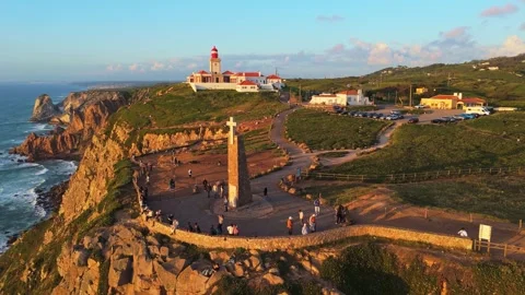 Cabo da Roca at Sunset. Cliffs, Lighthouse and Cross. Portugal. Aerial View Stock Footage 333898563