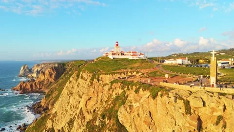 Cabo da Roca at Sunset. Cliffs, Lighthouse and Cross. Portugal. Aerial View Stock Footage 333898565