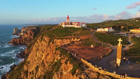 Cabo da Roca at Sunset. Cliffs, Lighthouse and Cross. Portugal. Aerial View Stock Footage 333898566