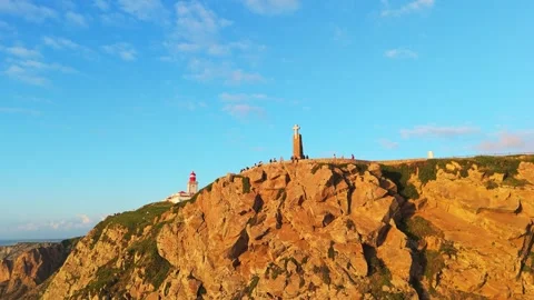 Cabo da Roca at Sunset. Cliffs, Lighthouse and Cross. Portugal. Aerial View Stock Footage 333898581