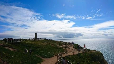 Cabo da Roca with visitors exploring the scenic landscape and a monument Stock Photos