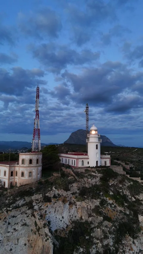 Cabo de la Nao Lighthouse and Communications Tower at Dusk, Javea Spain Stock Footage 340238979