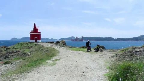 Cabo Home Cangas do Morrazo Red Lighthouse Bikes and Ship Stock Footage 79152531