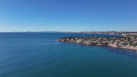 Cabo Roig Mediterranean Peninsula and Coastal Homes from Above Stock Footage 345529671