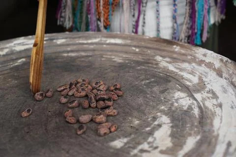 Cacao beans being roasted on a traditional comal plate to prepare chocolate Stock Photos