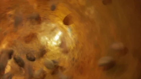Cacao Beans Falling into a Golden Rotating Cauldron Closeup Stock Footage 99163441