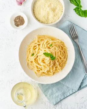 Cacio e pepe pasta. Spaghetti with parmesan cheese and pepper. Stock Photos