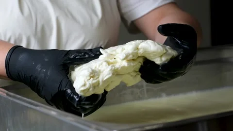 Caciocavallo kachakovala cheese preparation process female hands in black latex Stock Footage 274893584