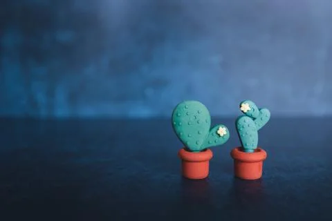 Cactus shaped erasers on a dark background. Teaching concept. Copy-space Foto stock