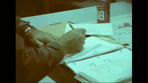 Cadet and instructor in a study hall during women pilot training - 1976 Stock Footage 103748521