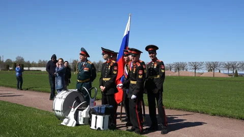 Cadets with a flag stand in the park Stock Footage 95064578