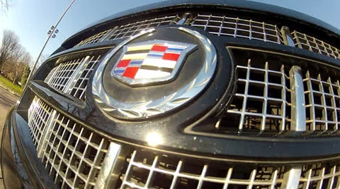 Cadillac Escalade emblem in motion Stock Footage 22575213