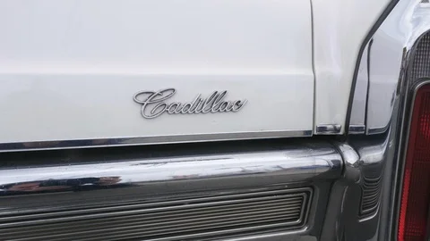 Cadillac script logo on old white Cadillac de Ville car. Video stock 90352186