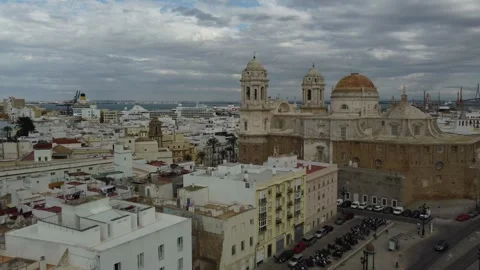 Cadiz Cathedral under Clouds: Epic 4K Drone Footage, Spain Stock Footage 246597908