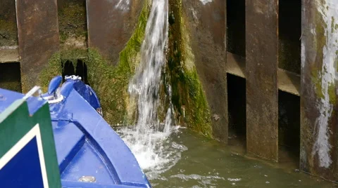 Caen Canal Locks. Close up of water coming through a lock gate Stock Footage 40604082