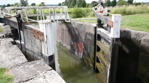 Caen Canal Locks.  The lock gates being pushed shut Stock Footage 40600870