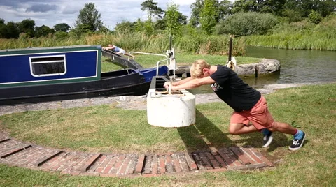 Caen Canal Locks. people push the gates open Video stock 40596098