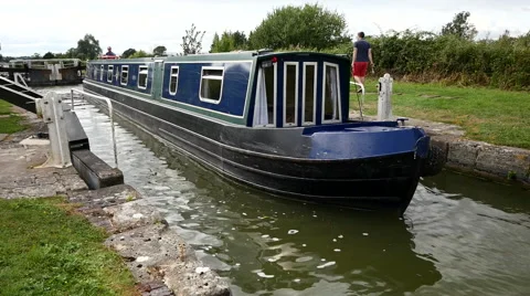 Caen Canal Locks. Shot at front of boat as it leaves a lock Video stock 40613596