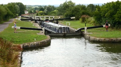 Caen Hill Canal Locks.  High shot of a boat in a lock Stock Footage 40626037
