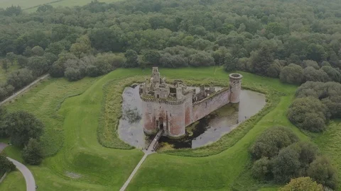 Caerlaverock Castle is a moated triangular castle Stock Footage 125391223