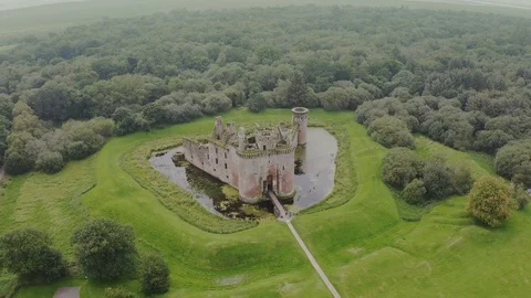 Caerlaverock Castle is a moated triangular castle Stock Footage 125395733