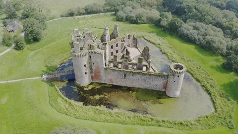 Caerlaverock Castle is a moated triangular castle Stock Footage 125397971