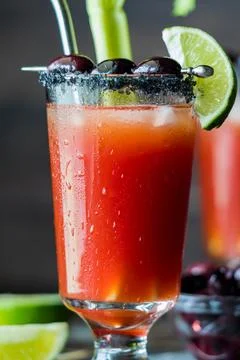 A Caesar drink with drops of condensation dripping down the front of the glass. Stock Photos