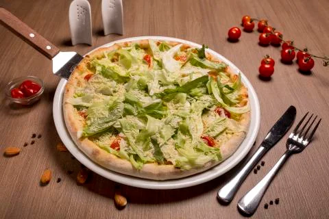 Caesar pizza thin cake, Caesar sauce, chicken fillet, tomatoes, mozzarella Stock Photos
