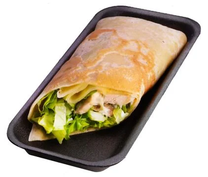 Caesar roll on a black tray on a white background. Stock Photos