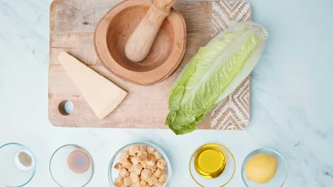 Caesar Salad and Sauce ingredients in 4k on the table ready for preparation. Stock Footage 140761885