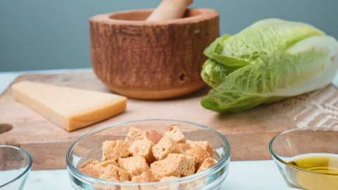 Caesar Salad and Sauce ingredients in 4k on the table ready for preparation. Stock Footage 140762553